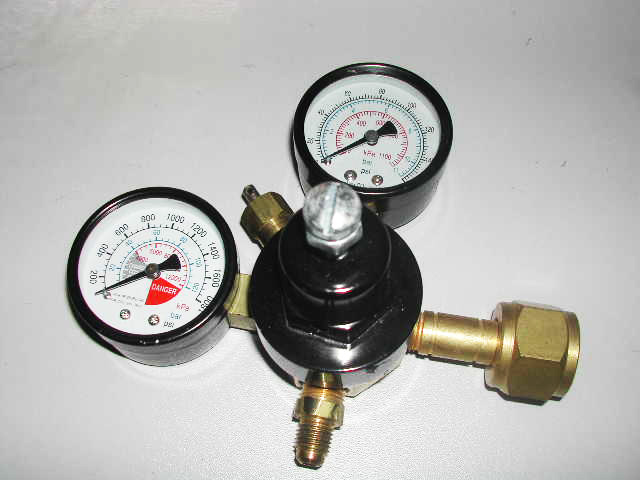 Pressure reducing gauge set for steam and water plants